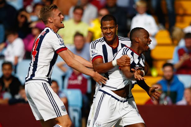 Saido Berahino of West Bromwich Albion celebrates scoring his team's first goal with his team mates Darren Fletcher and Salomon Rondon