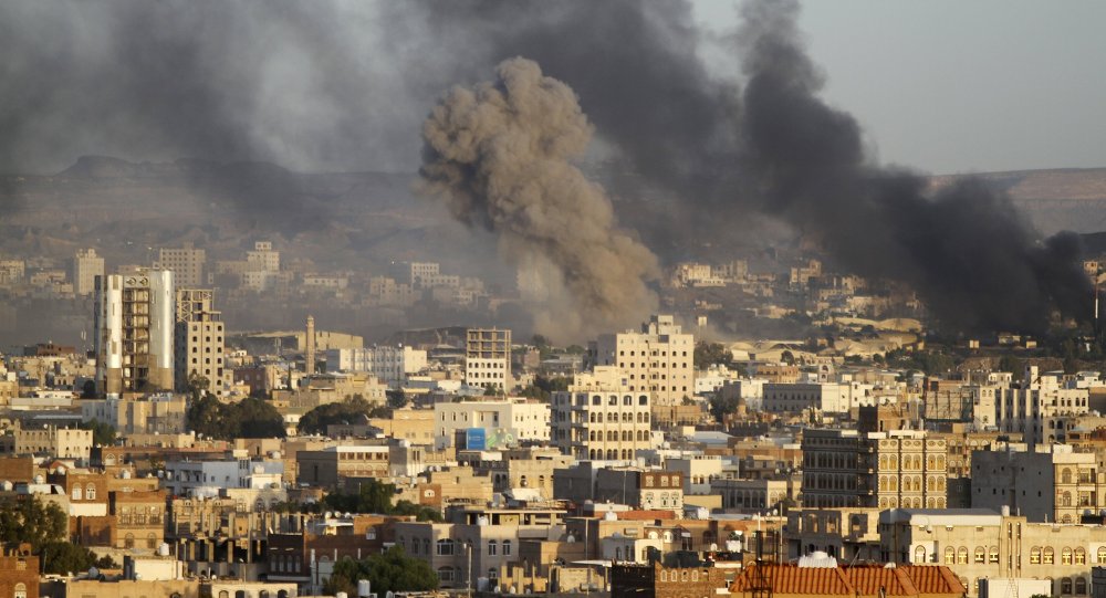 Smoke billows from a Houthi-controlled military base after a Saudi-led air strike hit its weapons depots in Yemen's capital Sanaa