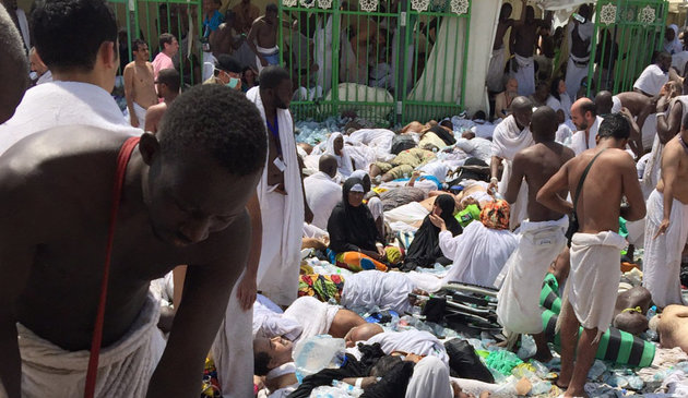 Muslim pilgrims gather around the victims of a stampede in Mina Saudi Arabia during the annual hajj pilgrimage on Thursday Sept. 24 2015. Hundreds were killed and injured Saudi authorities said. The crush happened in Mina a large valley about five