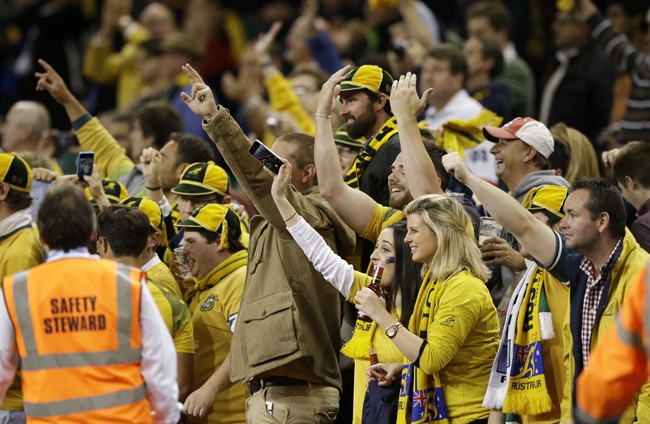 Australia fans celebrate at the end of the Rugby World Cup Pool A match between Australia and Fiji at the Millennium Stadium Cardiff Wednesday Sept. 23 2015. Australia won the match 28-13