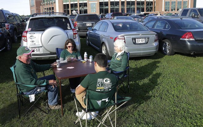 Darrel Schartner plays cards with his daughter Melanie Shilbauer wife Karen and grandson Grant Schilbauer before the Green Bay Packers game against the Seattle Seahawks on Sunday at Lambeau Field in Green Bay