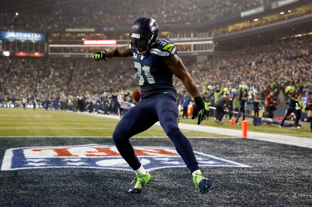 SEATTLE WA- JANUARY 10 Kam Chancellor #31 of the Seattle Seahawks celebrates after scoring a 90 yard touchdown off of an interception in the fourth quarter thrown by Cam Newton #1 of the Carolina Panthers iduring the 2015 NFC Divisional Playoff game