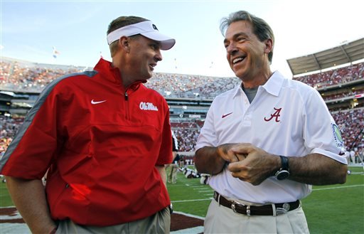 Alabama head coach Nick Saban talks with Mississippi head coach Hugh Freeze before an NCAA college football game in Tuscaloosa Ala. The 15th-ranked Rebels and No. 2 Alabama take center stage in Tuscaloosa on Sat