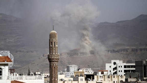 Smoke rises during an air strike on an army weapons depot on a mountain overlooking Yemen