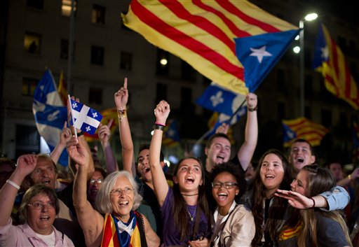 Catalonian pro-independence supporters celebrate in Barcelona Spain Sunday Sept. 27 2015. Voters in Catalonia participated in an election Sunday that could propel the northeastern region toward independence from the rest of Spain or quell secessionism