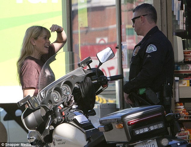 Spotted Terri Irwin stopped for a flirty chat with a police officer at a petrol station in LA