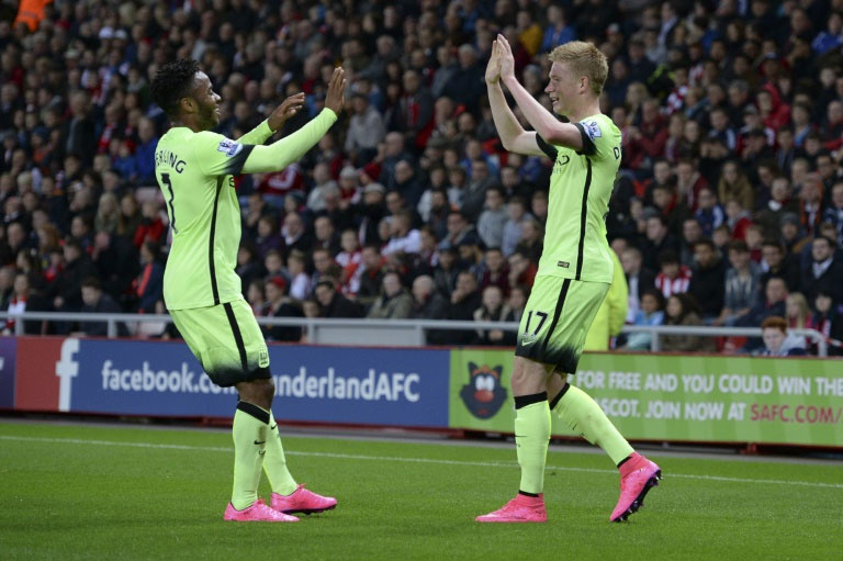 Manchester City's midfielder Raheem Sterling celebrates with midfielder Kevin De Bruyne after De Bruyne scored during an English League Cup third round football match against Sunderland at the Stadium of Light