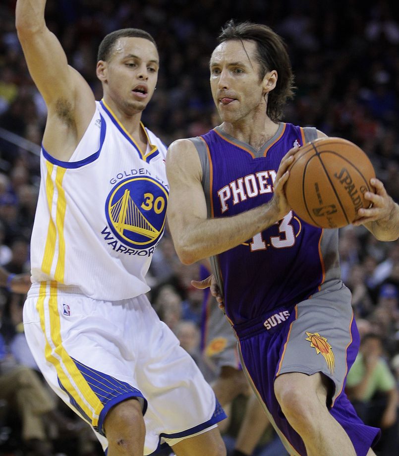 According to multiple media reports former Phoenix Suns guard Steve Nash- here guarded by Stephen Curry during a game in 2011- is in talks to join the Warriors coaching staff