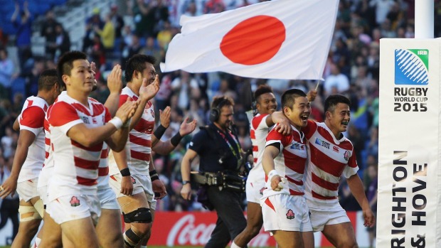 Japan players celebrate their surprise victory in the World Cup Pool B match between against South Africa at the Brighton Community Stadium