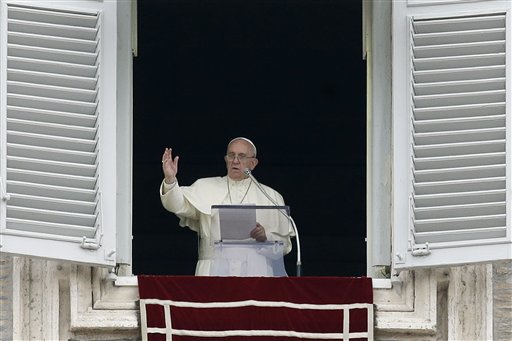 Pope Francis delivers a blessing from his studio's window overlooking St. Peter's Square on the occasion of the Angelus noon prayer at the Vatican Sunday Sept. 13 2015