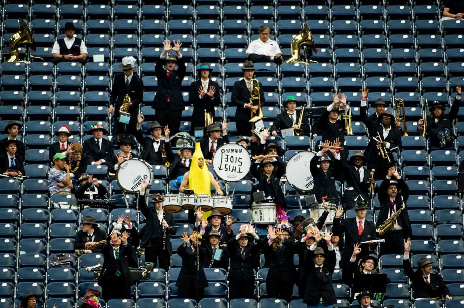 The Rice University Marching Owl Band cheers for their team against Houston during the first half of the annual Bayou Bucket college football game at Reliant Stadium Saturday Sept. 21 2013 in Houston