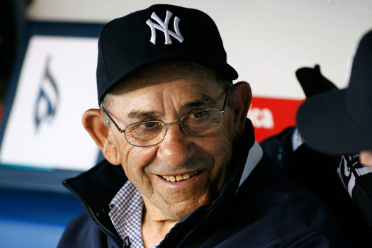 Hall of famer Yogi Berra formerly of the New York Yankees sits on the bench before the game against the Toronto Blue Jays during Opening Day at Yankee Stadium