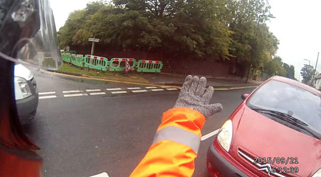 The car and bike were locked in rolling road rage battle in the streets of Hull. Source YouTube  Steve Midz