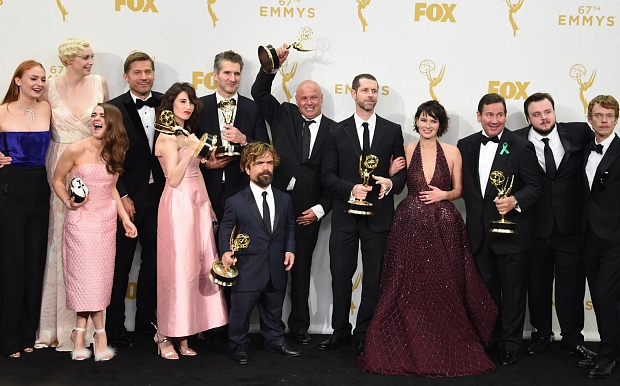 The cast of HBO's Game of Thrones celebrate in the press room