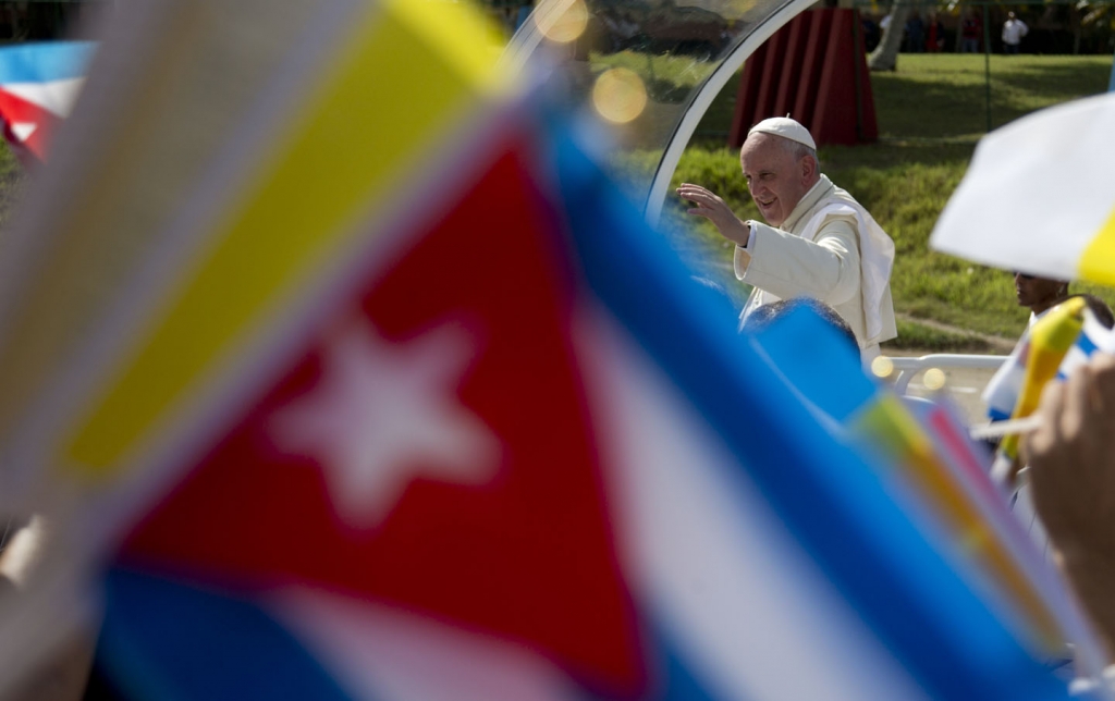 Pope Francis waves from his popemobile as he arrives to celebrate Mass at the Plaza of the Revolution in Holguin Cuba