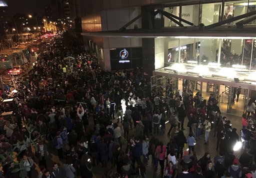 People evacuate a mall in Santiago after a powerful earthquake in Santiago Chile Wednesday Sept. 16 2015. The magnitude-8.3 earthquake hit off Chile's northern coast causing buildings to sway in Santiago and other cities and sending people runni