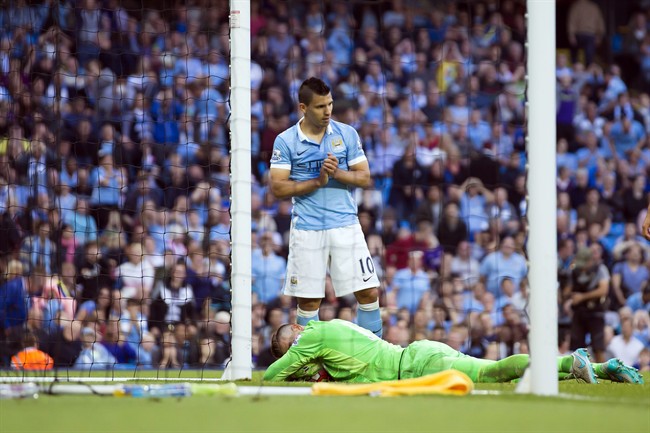 Manchester City's Sergio Aguero top reacts after a missed opportunity during the English Premier League soccer match between Manchester City and West Ham United at the Etihad Stadium Manchester England Saturday Sept. 19 2015