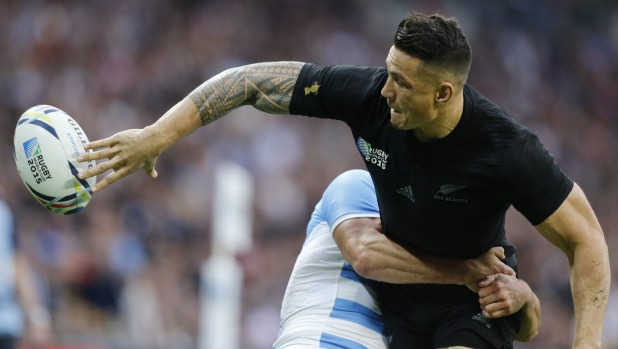 Trademark flick New Zealand's Sonny Bill Williams passes the ball as he is tackled by Argentina's Juan Imhoff