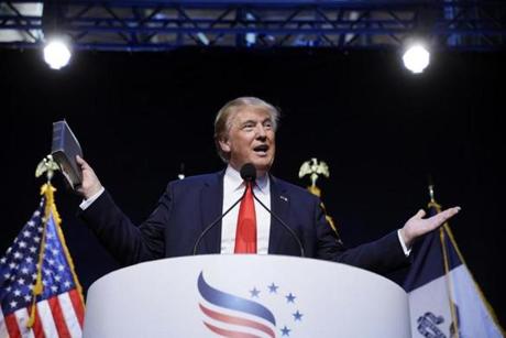 Republican presidential candidate Donald Trump held a Bible as he spoke Saturday during the Iowa Faith & Freedom Coalition's annual fall dinner in Des Moines