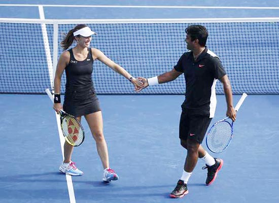 Paes and Hingis win third Slam mixed title of the year