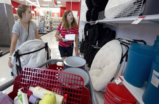 Boston University student Ashley Babula left shops for back-to-school items with her mother Mary at the City Target store in Boston. The Labor Department reports on consumer prices for August on Wednesday Sept. 16 2015