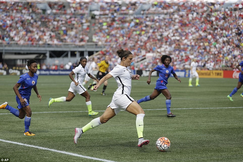 United States Carli Lloyd drives the ball on her way to scoring a goal against Haiti during the U.S. Women's World Cup soccer victory tour on Sunday