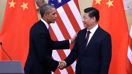 President Barack Obama shakes hands with Chinese President Xi Jinping after a joint press conference