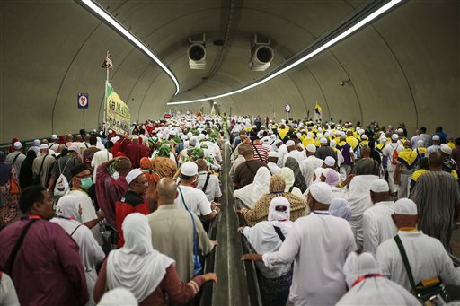 Muslim pilgrims walk in a tunnel on their way to cast stones at Jamarrat pillars a ritual that symbolises the stoning of Satan during the annual pilgrimage known as the hajj in Mina near the holy city of Mecca Saudi Arabia Friday Sept. 25 2015