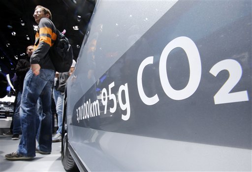 The amount of carbon dioxide emission is written on a Volkswagen Passat Diesel at the Frankfurt Car Show in Frankfurt Germany Tuesday Sept. 22 2015. Volkswagen has admitted that it intentionally installed software programmed to switch engines to a