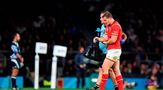 Wales&#039 Hallam Amos leaves the field of play with an injury during the Rugby World Cup match at Twickenham Stadium London