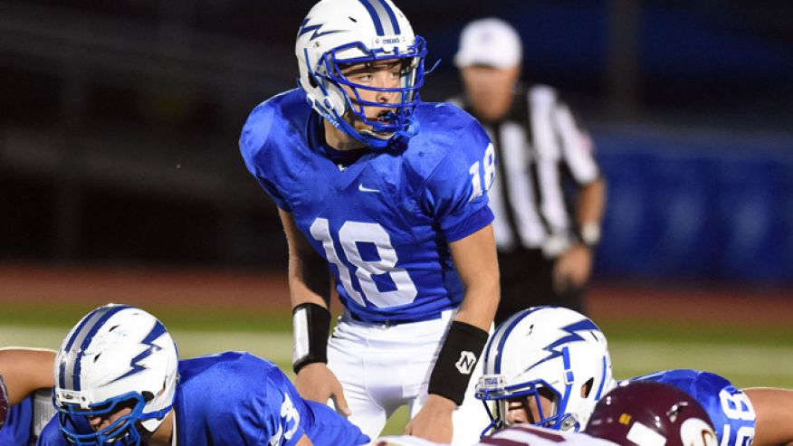 Warren Hills QB Evan Murray looks over the defense