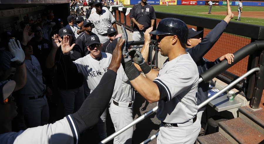 New York Yankees&#39 Carlos Beltran right is congratulated by teammates after hitting a three run home run off New York Mets starting pitcher Noah Syndergaard during the first inning of a baseball game Saturday Sept. 19 2015 in New York. (AP