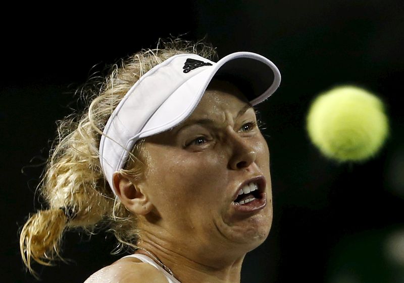 Caroline Wozniacki of Denmark eyes the ball as she returns a shot to Ana Konjuh of Croatia during their Pan Pacific Open women's singles tennis match in Tokyo Japan. – Reuters pic