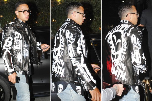 Memphis Depay parties after Manchester United's win with gold teeth