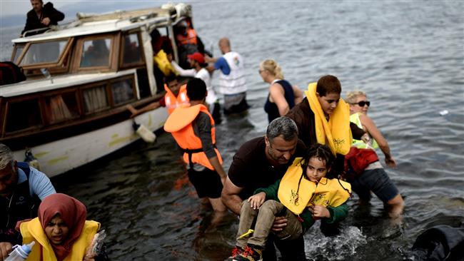 Refugees arrive in the Greek island of Lesbos after crossing the Aegean sea from Turkey