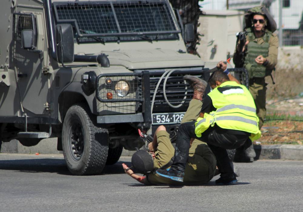 Palestinian man wearing ‘press t-shirt&#039 shot dead after stabbing Israeli soldier