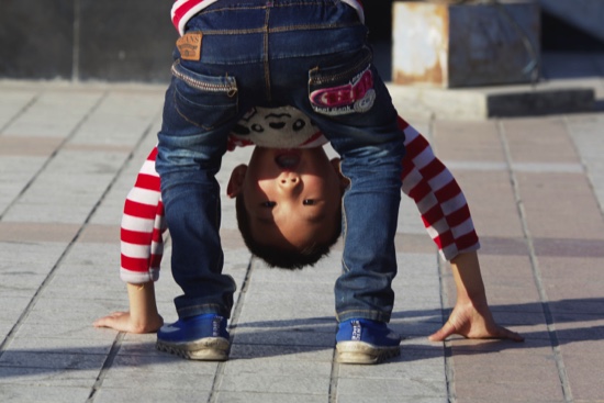 A child bends over in a public park in Yinchuan in northwestern China’s Ningxia Hui autonomous region