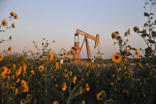A pump jack operates at a well site leased by Devon Energy Production Company near Guthrie Oklahoma