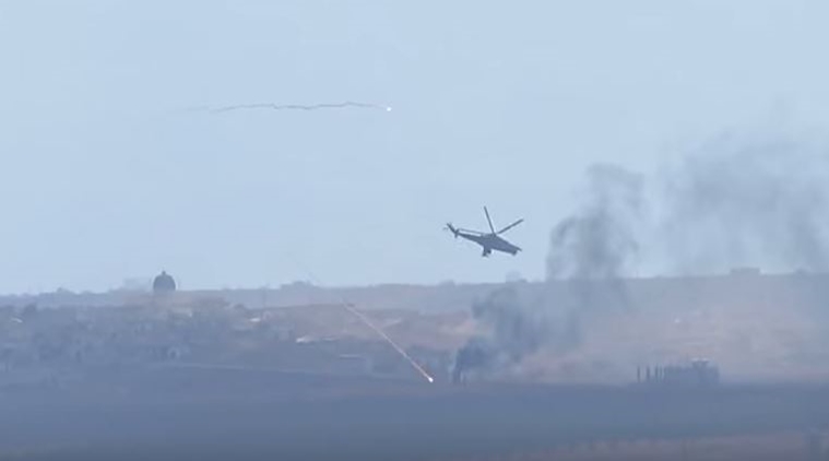 A video screenshot showing Russian helicopters hitting targets in Syria