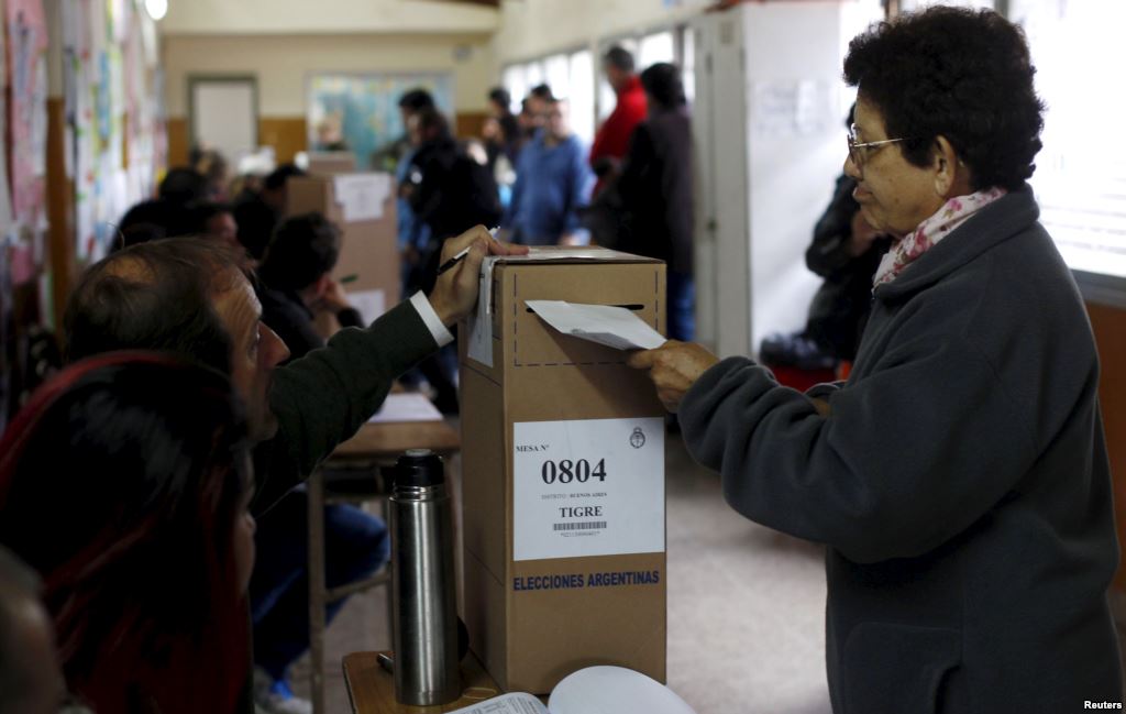 A woman casts her vote at a polling station in Buenos Aires Argentina Oct. 25 2015