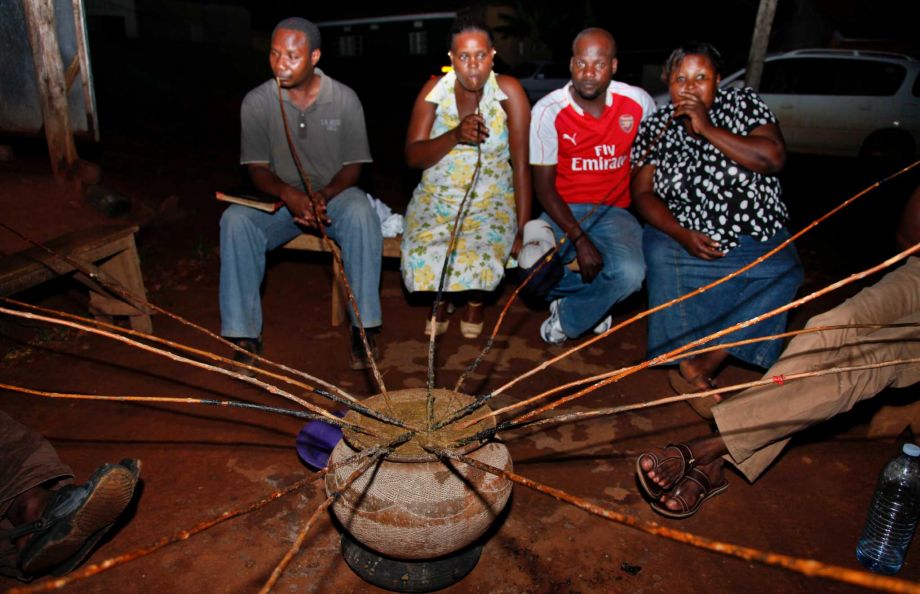 18 2015 Ugandans drink a local brew known as'malwa at the Charismatic Club in the Kitintale district of Kampala Uganda. With beer sales slowing in North America and Europe Anheuser Busch InBev has agreed to pay more