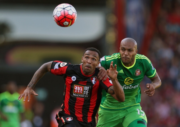 AFC Bournemouth's Callum Wilson and Sunderland's Younes Kaboul battle for the ball