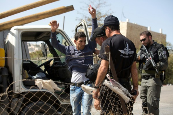 AFP  Manahem Kahana Israeli border police check a Palestinian driver outside the neighbourhood of Jabal Mukaber in East Jerusalem