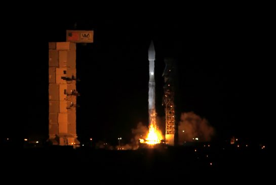 An Atlas V rocket carrying 13 Cube Sats launches from Space Launch Complex-3 on Thursday Oct. 8 2015 at Vandenberg Air Force Base Calif