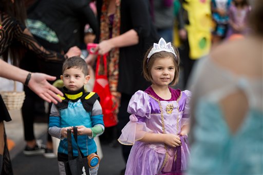 Children arrive during Halloween festivities near the South Portico of the White House in Washington Friday Oct. 30 2015. President Barack Obama and first lady Michelle Obama welcomed local children and children of military families to 'trick-or-t