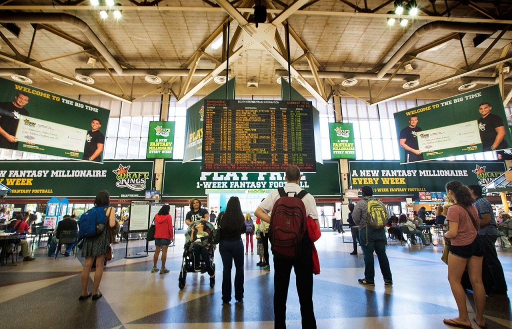 Advertisements for the online fantasy sports compant DraftKings based in Boston hang in South Station