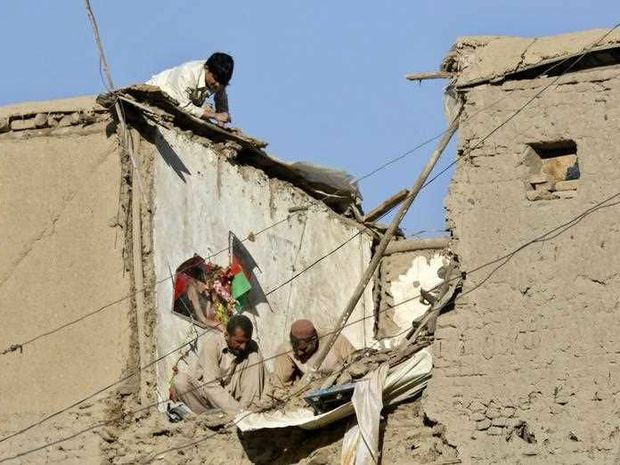 Afghans repair the damage caused by a 7.7 magnitude earthquake in Kabul Afghanistan