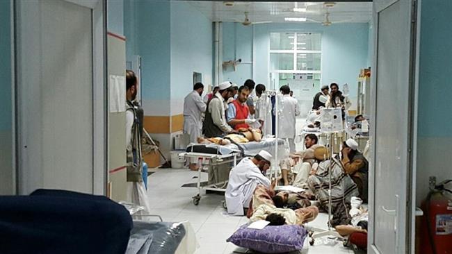 Afghan MSF medical personnel treat civilians injured following an offensive against Taliban militants by Afghan and coalition forces at the MSF hospital in Kunduz Afghanistan