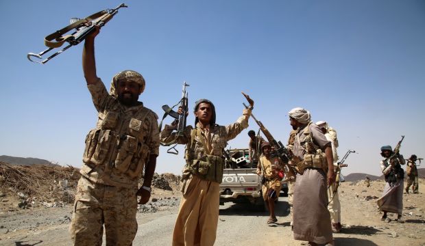 Armed Yemeni tribesmen from the Popular Resistance Committees supporting forces loyal to Yemen's Saudi-backed President Abd Rabbuh Mansur Hadi jubilate on a road after seizing control of an area in Ma'rib province east of the capital Sana&#03