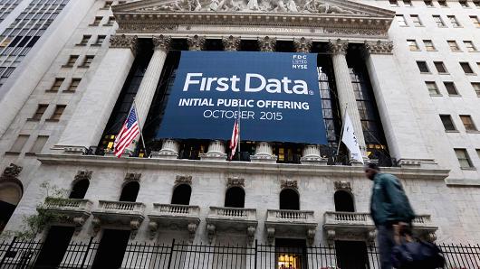 A banner for First Data Corp. adorns the facade of the New York Stock Exchange to mark the company's IPO Thursday Oct. 15 2015